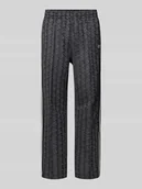 Spodnie sportowe męskie - Spodnie dresowe o kroju regular fit z dodatkiem bawełny - miniaturka - grafika 1