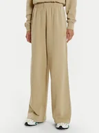 Spodnie sportowe damskie - Lacoste Spodnie dresowe XF2657 Beżowy Wide Leg - miniaturka - grafika 1