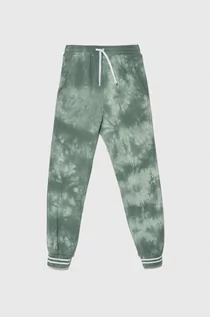 Spodnie i spodenki dla chłopców - United Colors of Benetton spodnie dresowe bawełniane dziecięce kolor zielony wzorzyste - grafika 1