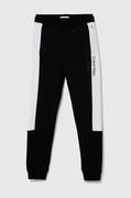 Spodnie i spodenki dla chłopców - Calvin Klein Jeans spodnie dresowe bawełniane dziecięce kolor czarny wzorzyste - miniaturka - grafika 1