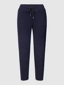 Spodnie sportowe damskie - Spodnie dresowe z lamowanymi kieszeniami z tyłu - miniaturka - grafika 1