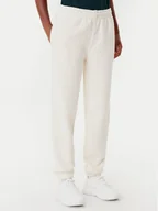 Spodnie sportowe damskie - Lacoste Spodnie dresowe XF0353 Beżowy Regular Fit - miniaturka - grafika 1
