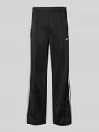 Spodnie damskie - Spodnie dresowe z elastycznym ściągaczem - miniaturka - grafika 1