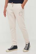 Spodnie męskie - Tommy Hilfiger spodnie dresowe kolor beżowy z nadrukiem - miniaturka - grafika 1
