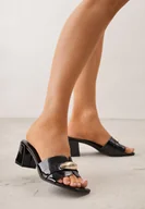 Klapki i japonki damskie - Czarne Eleganckie Klapki na Słupku z Metaliczną Podłużną Aplikacją Hypsobe - miniaturka - grafika 1