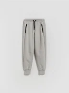 Spodnie i spodenki dla chłopców - Reserved - Bawełniane spodnie jogger - jasnoszary - miniaturka - grafika 1