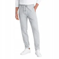 Dresy męskie - Męskie spodnie dresowe marchewkowy krój szary melanż V3 OM-PASK-0166 XXL - miniaturka - grafika 1