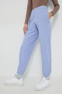 Spodnie damskie - Superdry spodnie dresowe bawełniane damskie kolor fioletowy gładkie - grafika 1