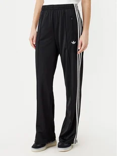 adidas Spodnie dresowe adicolor Classic Firebird JC8245 Czarny Loose Fit - Spodnie sportowe damskie - miniaturka - grafika 1