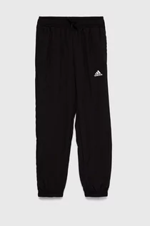 Spodnie i spodenki dla chłopców - Adidas spodnie dresowe dziecięce kolor czarny z nadrukiem - adidas - grafika 1