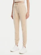 Spodnie sportowe damskie - Guess Spodnie dresowe V3BB27 K0232 Beżowy Regular Fit - miniaturka - grafika 1
