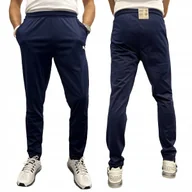 Spodnie sportowe męskie - Puma spodnie dresowe męskie Liga training pant Core niebieski rozmiar XL - miniaturka - grafika 1