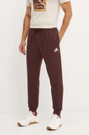 Spodnie męskie - adidas spodnie dresowe Essentials kolor brązowy z aplikacją IY9086 - miniaturka - grafika 1