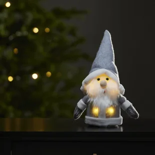 Szwedzka Figurka Święty Mikołaj LED JOYLIGHT 24 cm, Miękka Tkanina, Szary Płaszcz, Na Baterie, Dekoracja Świąteczna - Ozdoby bożonarodzeniowe Szwedzka Figurka Święty Mikołaj LED JOYLIGHT 24 cm, Miękka Tkanina, Szary Płaszcz, Na Baterie, Dekoracja Świąteczna - Ozdoby bożonarodzeniowe - miniaturka - grafika 1