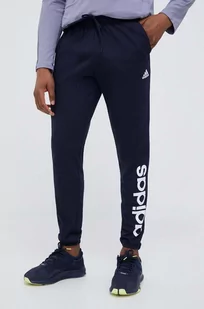 adidas spodnie treningowe Essentials kolor granatowy z nadrukiem - Spodnie męskie - miniaturka - grafika 1