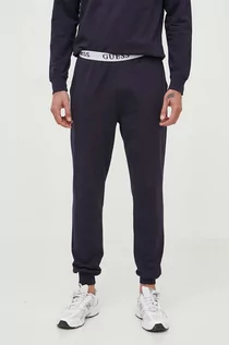 Spodnie męskie - Guess spodnie dresowe kolor granatowy gładkie - grafika 1