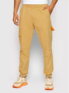 Spodnie damskie - Outhorn Spodnie materiałowe SPMC600 Żółty Regular Fit - grafika 1