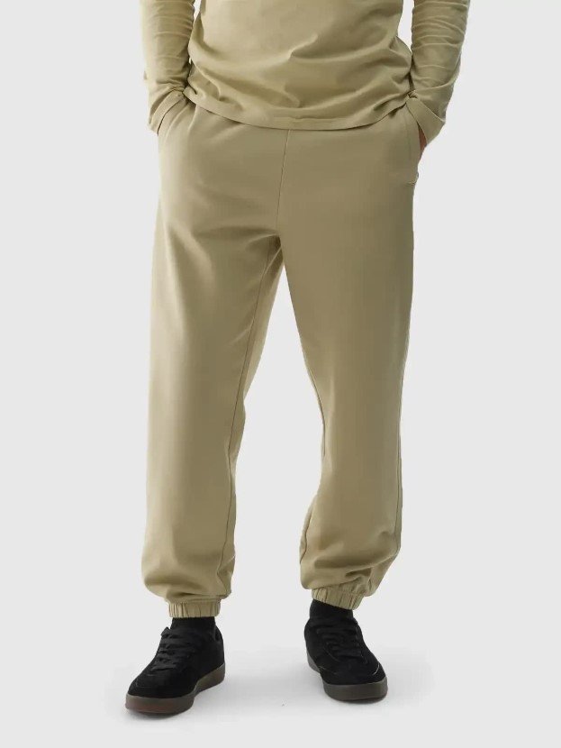 Spodnie dresowe oversize męskie 4F 4FWAW24TTROM0824-44S Zielony