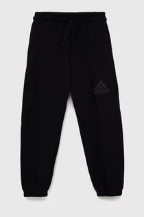 Spodnie damskie - adidas spodnie dresowe dziecięce U FI LOGO kolor czarny gładkie - grafika 1