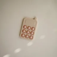Zabawki interaktywne dla dzieci - Mushie Zabawka sensoryczna Bąbelki do wciskania telefon Blush - miniaturka - grafika 1