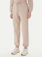 Spodnie sportowe damskie - Guess Spodnie dresowe V5BB23 KCX22 Beżowy Regular Fit - miniaturka - grafika 1