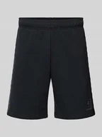 Spodnie sportowe męskie - Szorty z dzianiny dresowej o kroju tapered fit z nadrukiem z logo - miniaturka - grafika 1