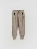 Spodnie i spodenki dla chłopców - Reserved - Bawełniane spodnie jogger - beżowy - miniaturka - grafika 1