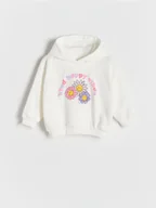 Bluzy dla dziewczynek - Reserved - Bawełniana bluza SmileyWorld® z aplikacją - złamana biel - miniaturka - grafika 1
