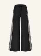 Spodnie damskie - Adidas Originals Spodnie Dresowe Firebird Oversized schwarz - adidas Originals - miniaturka - grafika 1