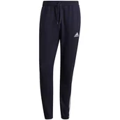 Spodnie męskie - Spodnie męskie adidas Essentials Tapered Elastic Cuff 3 Stripes Pant granatowe GK8830-S - miniaturka - grafika 1