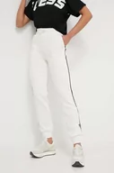 Spodnie damskie - Guess spodnie dresowe kolor beżowy z aplikacją - miniaturka - grafika 1