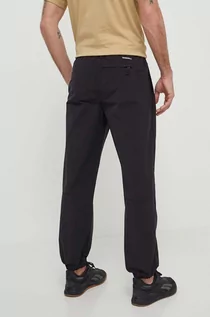 Spodnie męskie - The North Face spodnie dresowe kolor czarny gładkie NF0A8767JK31 - grafika 1