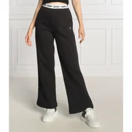 Dresy damskie - Tommy Jeans Spodnie dresowe | Loose fit - miniaturka - grafika 1