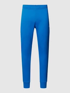 Spodnie dresowe z naszywką z logo model ‘TRACKSUIT TROUSERS’ - Spodnie sportowe męskie - miniaturka - grafika 1