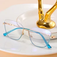 Okulary korekcyjne, oprawki, szkła - Damskie okulary półramki kocie zerówki do komputera BLUE LIGHT 25142D Złoty/Niebieski - miniaturka - grafika 1