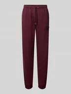 Spodnie sportowe damskie - Spodnie dresowe o kroju slim fit z naszywką z logo model ‘Tonal’ - miniaturka - grafika 1