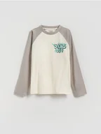 Bluzki dla chłopców - Reserved - Bawełniany longsleeve z nadrukiem - złamana biel - miniaturka - grafika 1
