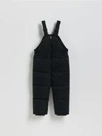 Spodnie i spodenki dla dziewczynek - Reserved - Gumowane spodnie na szelkach - czarny - miniaturka - grafika 1