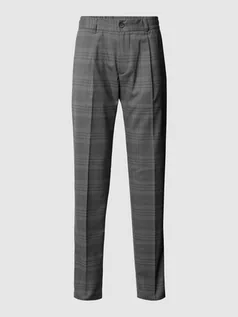Spodnie męskie - Spodnie sportowe z elastycznej mieszanki wełny ze wzorem w kratkę - grafika 1