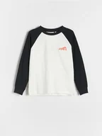 Bluzki dla chłopców - Reserved - Bawełniany longsleeve z nadrukiem - złamana biel - miniaturka - grafika 1