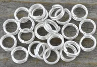 Biżuteria - akcesoria - [301001] Ogniwa sprężynki 5mm kolor srebrny 130szt - miniaturka - grafika 1