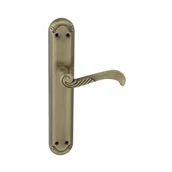 Klamki - Domino Klamka do drzwi wewnętrznych z długim szyldem Casablanka mosiądz/patyna - miniaturka - grafika 1