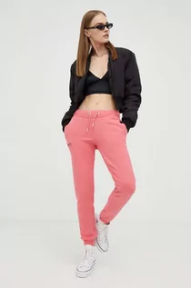 Spodnie damskie - Superdry spodnie dresowe kolor różowy gładkie - grafika 1