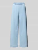 Spodnie damskie - Spodnie dresowe o kroju regular fit z rozkloszowanymi nogawkami - miniaturka - grafika 1