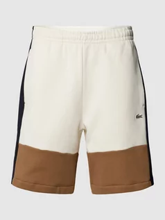 Spodnie sportowe męskie - Szorty z dzianiny dresowej w stylu Colour Blocking - grafika 1