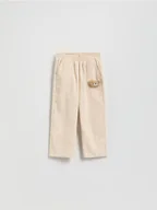 Spodnie i spodenki dla dziewczynek - Reserved - Sztruksowe spodnie z aplikacją - kremowy - miniaturka - grafika 1