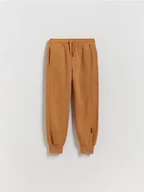 Spodnie i spodenki dla chłopców - Reserved - Dzianinowe joggery - brązowy - miniaturka - grafika 1