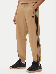 adidas Spodnie dresowe adicolor Woven Firebird JY1339 Beżowy Regular Fit - Spodnie sportowe męskie - miniaturka - grafika 1