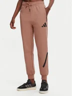 Spodnie sportowe damskie - adidas Spodnie dresowe Z.N.E. JD5995 Różowy Regular Fit - miniaturka - grafika 1