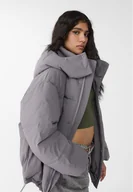 Kurtki damskie - Stradivarius Pikowana kurtka oversize z kapturem Szary L - miniaturka - grafika 1